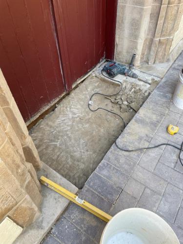 New sandstone step for entrance being put in place 2021